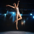 Ballet dancer in jump on theater stage Royalty Free Stock Photo