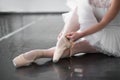 Ballet dancer legs in pointe shoes closeup