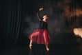 Ballet dancer in red dress dancing on the stage Royalty Free Stock Photo