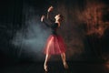 Ballet dancer in red dress dancing on the stage Royalty Free Stock Photo
