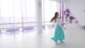 Ballet dancer is rehearsing a dancing elements.