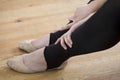 Ballet Dancer Relaxing On Wooden Floor Royalty Free Stock Photo