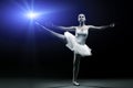 Ballet dancer in white tutu posing on one leg Royalty Free Stock Photo