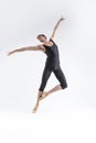 Ballet Dancer Young Athletic Man in Black Suit Posing in Stretching Pose Studio On White Royalty Free Stock Photo