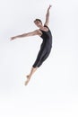 Ballet Dancer Young Man in Black Dance Suit Posing in Flying Ballanced Dance Pose Studio