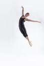 Ballet Dancer Young Man in Black Dance Suit Posing in Flying Ballanced Dance Pose Studio On White