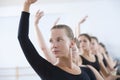 Ballet Dancers Practicing At The Barre