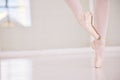Ballet feet or legs on the tiptoe dancing or practicing in a dance studio or class with copy space. Closeup of an Royalty Free Stock Photo