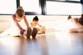 Ballet Girls Doing Sit and Reach Warm up Exercise