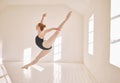 Ballet, jump and performance dance studio with young student. Dancer girl with energy in  classroom and moving Royalty Free Stock Photo