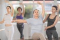 Ballet lesson for amateurs - choreographer teaches women of different ages different ballet steps in studio