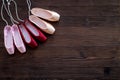 Ballet pointe shoes on dark wooden background top view copy space Royalty Free Stock Photo