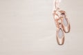 Ballet pointe shoes isolated on wooden background Royalty Free Stock Photo