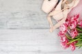 ballet, pointe shoes, tutu and bouquet of flowers on wooden background Royalty Free Stock Photo