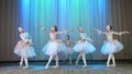 ballet rehearsal, on the stage of the old theater hall. Young ballerinas in elegant dresses and pointe shoes, dance Royalty Free Stock Photo