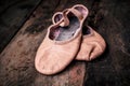 Ballet shoes on wooden floor. Royalty Free Stock Photo