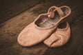 Ballet shoes on wooden floor. Royalty Free Stock Photo