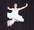 Ballet woman dancer, dancing does dance jump in air during creative stage performance. Professional ballerina practicing Royalty Free Stock Photo