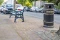 Ballina, County Mayo, Ireland - August 01 2022 : Bin and bench standing in Ballina town.