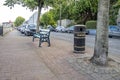 Ballina, County Mayo, Ireland - August 01 2022 : Bin and bench standing in Ballina town.