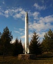 A ballistic missile on a stone pedestal.Small monument in the city