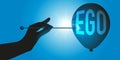 Egocentrism concept with a hand punching a balloon with the word ego written on it. Royalty Free Stock Photo