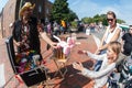 Balloon Animal Vendor Makes A Cat For Girl At Festival Royalty Free Stock Photo