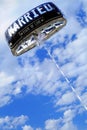 Balloon of the bride and groom with written Married flies on blue cloudy sky in background Royalty Free Stock Photo