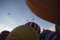 Balloon festival many aerostatics balloons rasing them up at bawn Royalty Free Stock Photo