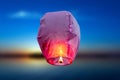 Balloon fire Sky lantern flying lanterns, hot-air balloons Lantern flies up highly in the sky. Sea blur backgrounds Royalty Free Stock Photo