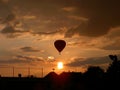 Balloon floating on evening sky with clouds