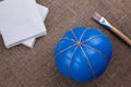 A balloon in jute, cloths, brush for glue, making a pumpkin out of paper-mache for Halloween, decor for the isolation Royalty Free Stock Photo