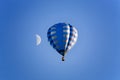 Balloon and moon on the blue sky