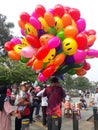 Balloon seller in the Bogor city square. West Java, Indonesia - October 22 2023