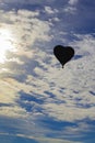 The balloon in the shape of a heart, Colorful hot-air balloon flying