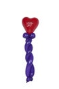 Balloon shaped into wand text in hart I love you