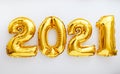 2021 balloon text on white background. Happy New year eve invitation with Christmas gold foil balloons 2021. Flat lay long web