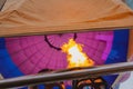 Balloon view from inside, fire from burner. A hot air balloon ride
