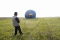 After ballooning: workers setting equipment after ballooning in a field