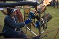 Balloonist operating burner Royalty Free Stock Photo