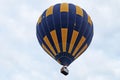 Balloons of blue and yellow color rises into the sky Royalty Free Stock Photo