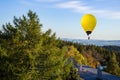 Balloons fly in clouds of clear sky.