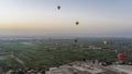 Balloons fly over the Nile Valley at dawn. Royalty Free Stock Photo