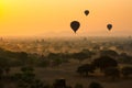 Balloons fly over thousand of temples in sunrise in Bagan, Myanmar