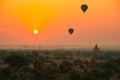 Balloons fly over thousand of temples in sunrise in Bagan, Myanmar