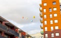 Balloons Flying In City Against Sky. Many hot air balloons of different shapes and colors. Front view of colorful hot air balloons Royalty Free Stock Photo