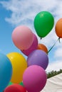 Balloons flying at a festival.