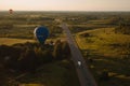 Balloons flying over the road in the countryside