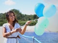 Balloons always make her smile. a gorgeous tattooed young woman holding balloons. Royalty Free Stock Photo