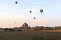 Balloons over Bagan at sunrise with horses Royalty Free Stock Photo